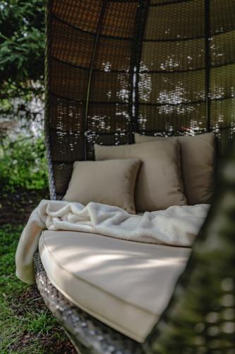 a bed in a hanging basket with pillows at Appartements KATHRIN in Grossarl