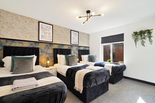 Ένα ή περισσότερα κρεβάτια σε δωμάτιο στο Stylish Yorkshire Apartment - Sleeps 5