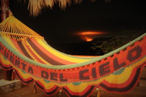 a hammock with a sign that says nothing is left out at Casa Maya Lodge in Masatepe