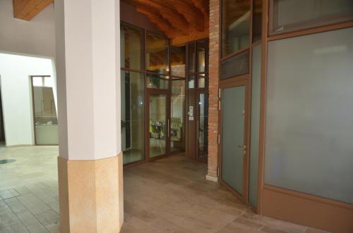 a hallway of a building with a white column at Palazzo Maggiore Suite B in Noale
