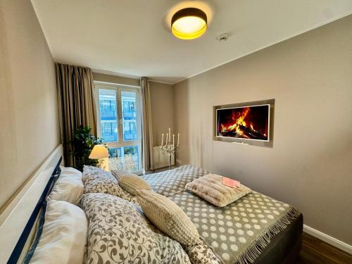 Postel nebo postele na pokoji v ubytování Ferienwohnung Nr 124 Sehnsucht-Zingst