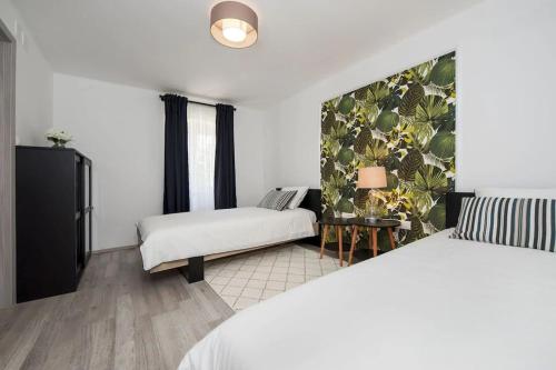 Postel nebo postele na pokoji v ubytování House Nina