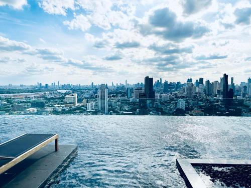 a view of a city from the water at Gateaway sukhumvit 42 home in Bangkok