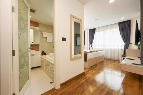 Postel nebo postele na pokoji v ubytování Shine Aparthotels Sukhumvit Thonglor