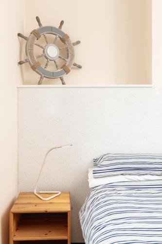 a bedroom with a bed and a wooden nightstand next to a wooden table at The Town House in Whitby