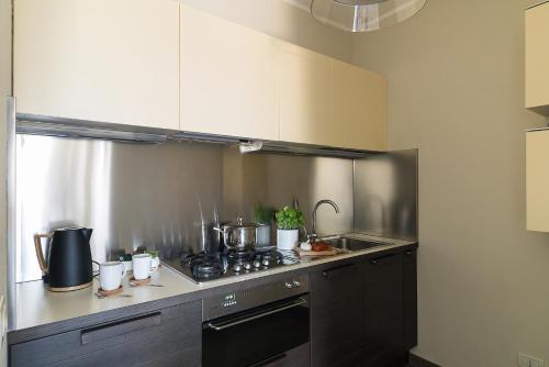 Kuchyň nebo kuchyňský kout v ubytování Montecarlo Charme Apartment