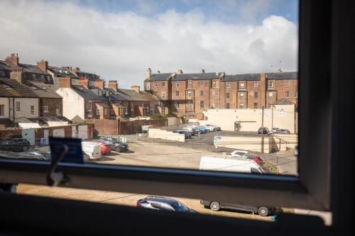 a view of a parking lot from a window at The Town House in Whitby