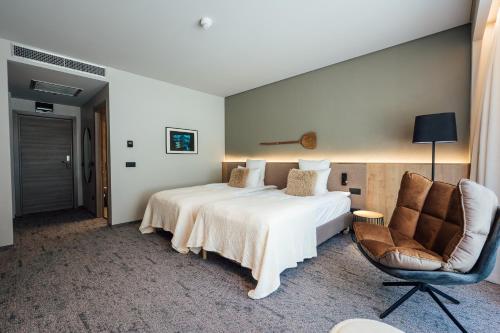 Letto o letti in una camera di Balvanyos Resort - Peakture Hotel & Grand Hotel Balvanyos
