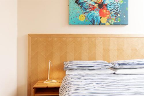 a bedroom with a bed and a painting on the wall at The Town House in Whitby