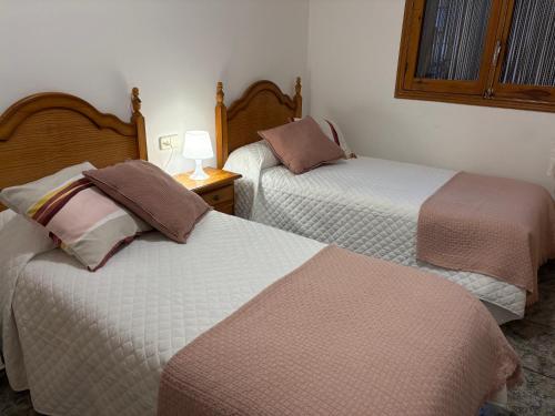 Postel nebo postele na pokoji v ubytování Hostal San José Naval