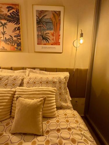 Ένα ή περισσότερα κρεβάτια σε δωμάτιο στο Unicco Apartment, near USP