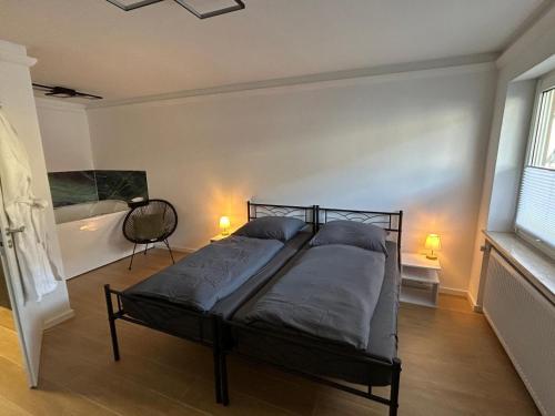Ένα ή περισσότερα κρεβάτια σε δωμάτιο στο RheinSchatz Apartments 1