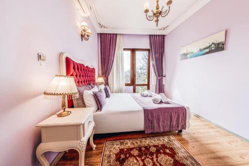 Postel nebo postele na pokoji v ubytování Olive Garden Apart