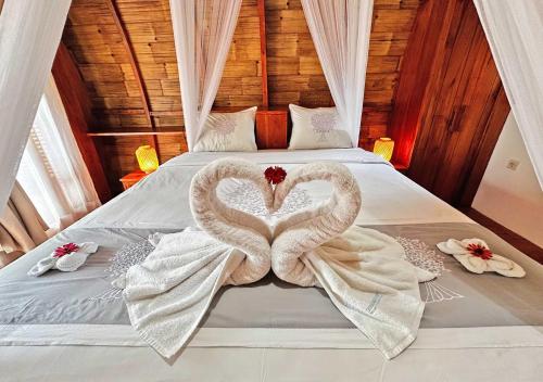 Кровать или кровати в номере Lagoona Beach Bungalows - Eco Stay