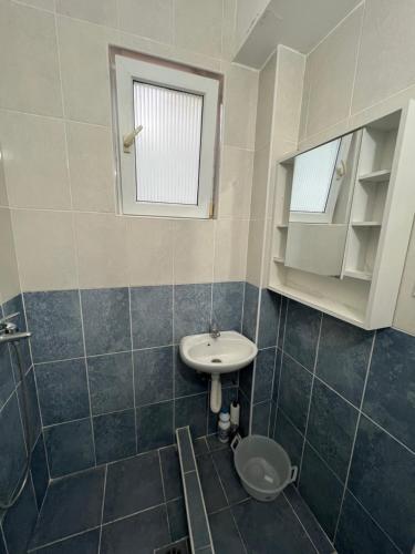 a bathroom with a sink and a toilet in it at Green Villa in Bar, Susanj