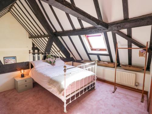 Ένα ή περισσότερα κρεβάτια σε δωμάτιο στο Wyre Court Cottage