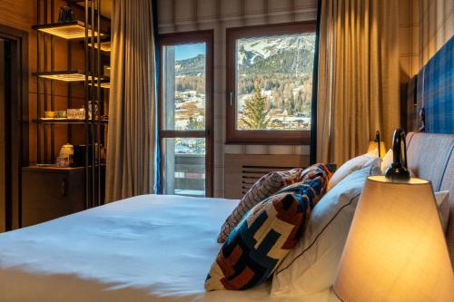 En eller flere senge i et værelse på Eight Cortina