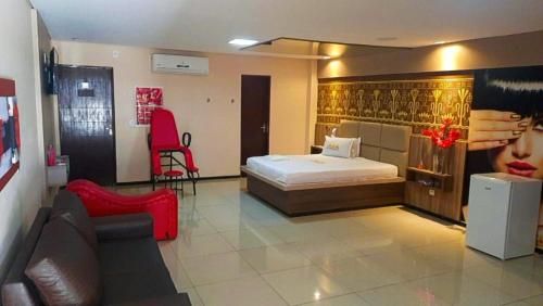 Ένα ή περισσότερα κρεβάτια σε δωμάτιο στο Motel Faraó
