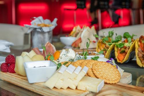 a tray of cheese and corn on a table at VIP Executive Arts Hotel in Lisbon