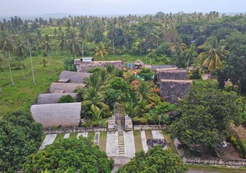 an aerial view of a resort with palm trees at Lagoona Beach Bungalows - Eco Bungalows Batukaras in Batukaras