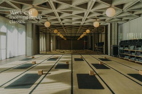 a large room with yoga mats on the floor at Mix Brussels --Gym & Wellness for adults only-- in Brussels
