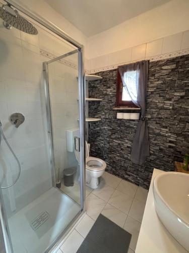 a bathroom with a shower and a toilet at La casetta di Tato in Monterosso al Mare