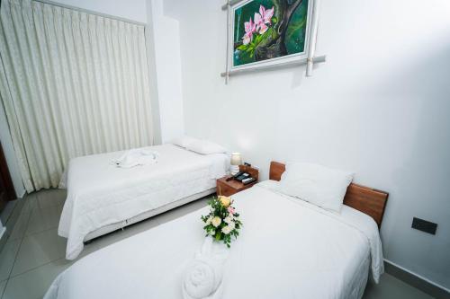 Postel nebo postele na pokoji v ubytování Hotel Suisui