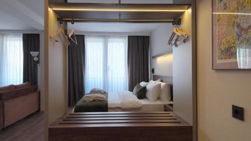 a hotel room with a bed and a mirror at Yıldız Termal Otel in Çekirge İstasyonu
