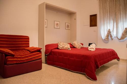 En eller flere senge i et værelse på Locorotondo Home Holidays