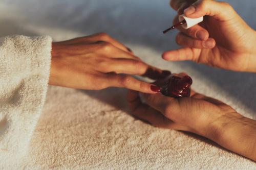 a person getting their nails done at a salon at Hôtel Plage Palace & Spa in Palavas-les-Flots