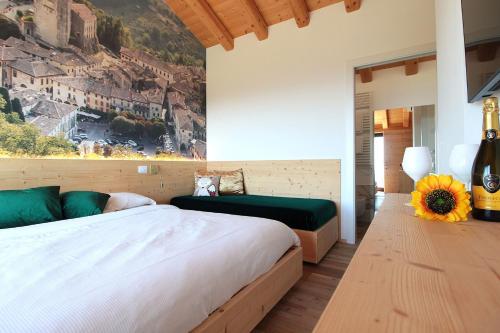 a bedroom with a bed and a view of a city at Villa Montello Pool, Jacuzzi, Ac, Wifi, Treviso in Volpago del Montello