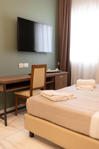 Postel nebo postele na pokoji v ubytování Mathera Boutique
