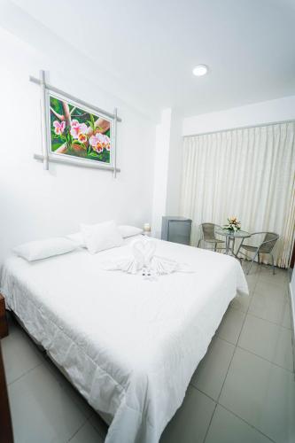Postel nebo postele na pokoji v ubytování Hotel Suisui