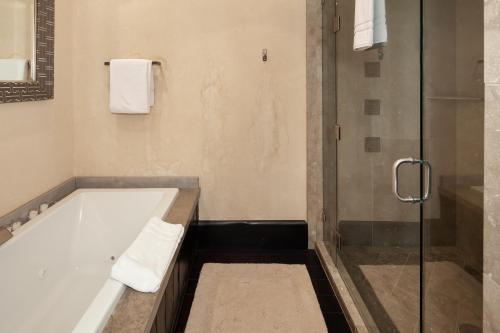a bathroom with a bath tub and a shower at Lodge at Whitefish Lake in Whitefish