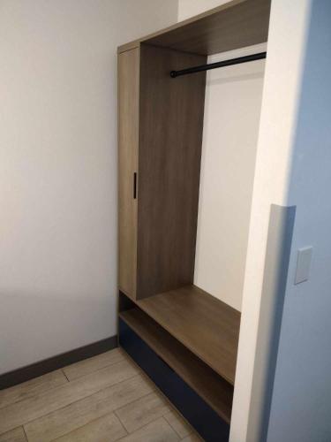 a closet with a wooden door in a room at Comfort Inn Grand Junction I-70 in Grand Junction