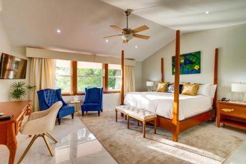 a bedroom with a bed and a desk and chairs at San Ignacio Resort Hotel in San Ignacio