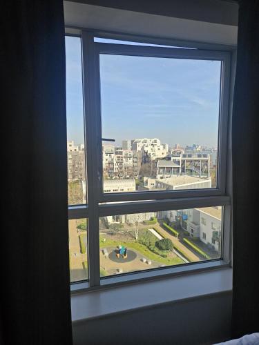 a window in a room with a view of a city at En-suite room LGBTQ friendly in London