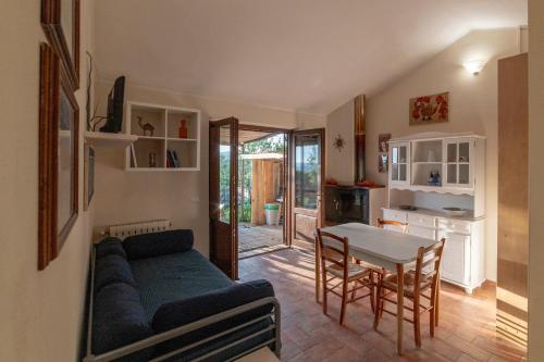 a living room with a couch and a table at Agriturismo Fontenuova in Saturnia