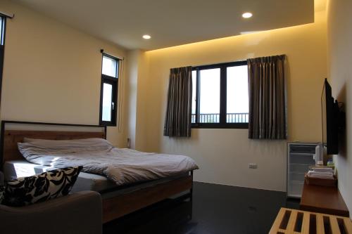 Cama o camas de una habitación en 晨民宿 Morning Homestay