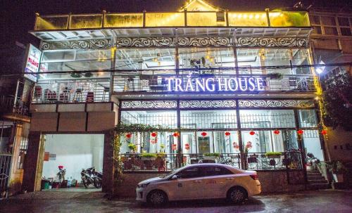 a white car parked in front of a fire house at Ami House Da Lat in Da Lat