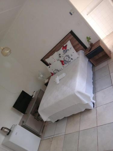 a bed in a room with two pillows at Mlawu Guest House in Margate