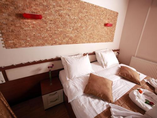 Postel nebo postele na pokoji v ubytování Arife Sultan Hotel