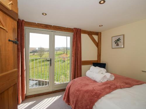 Postel nebo postele na pokoji v ubytování Cuckoo Pen Cottage