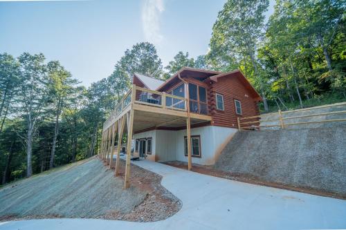 a house with a deck on top of a hill at Sunshine Hill in Fairview