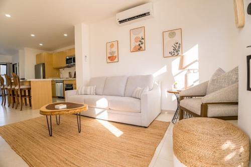 a living room with a white couch and a table at Cabo San Lucas House, 2Bedroom, 2Bathrooms,Pool, Rooftop views in El Pueblito