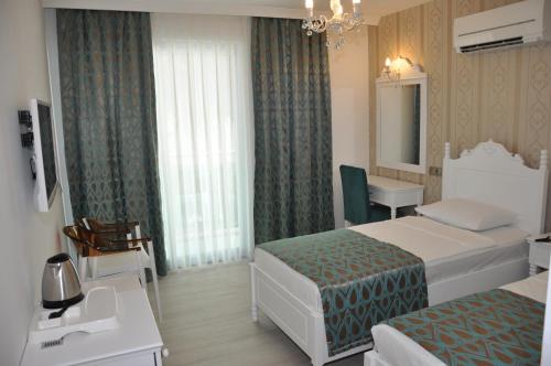 Katil atau katil-katil dalam bilik di Kleopatra Atlas Hotel - Adults Only