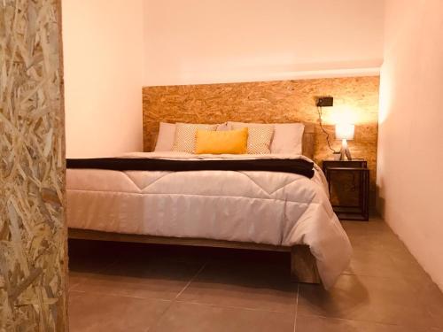 a bedroom with a large bed in a room at Budget Rooms by LA88 in St. Paul's Bay