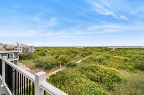 a balcony of a house with a view of the ocean at Direct Ocean Front Townhouse! An oceanside gem perfect for any vacation! in Brigantine