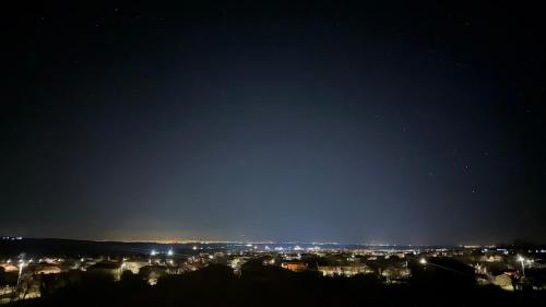 a city at night with the stars in the sky at Luxury House Veles in Hisarya