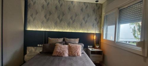 Postel nebo postele na pokoji v ubytování Apartamento Bento Gonçalves com Academia